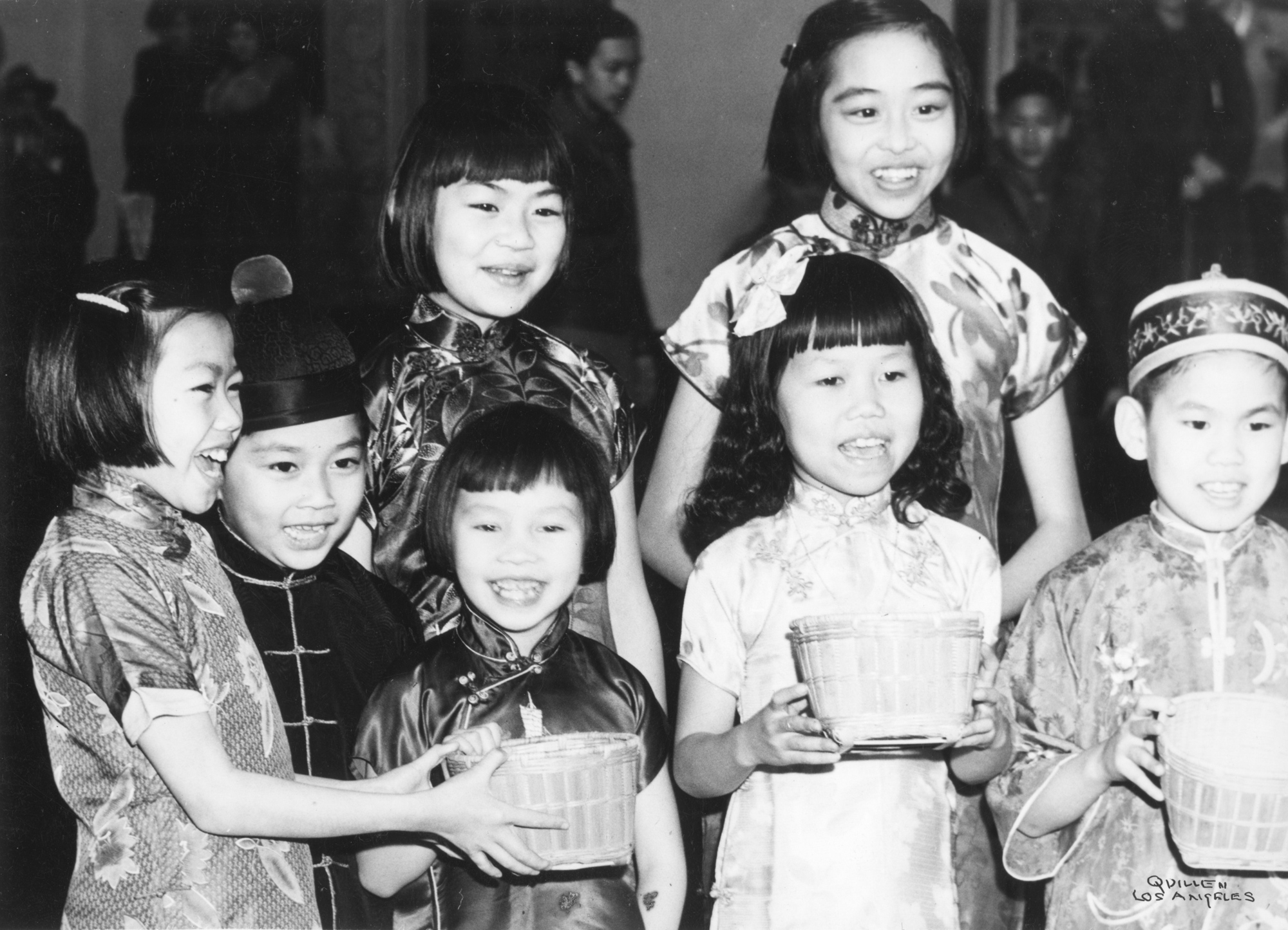 Children singing in traditional dress (c. 1940)